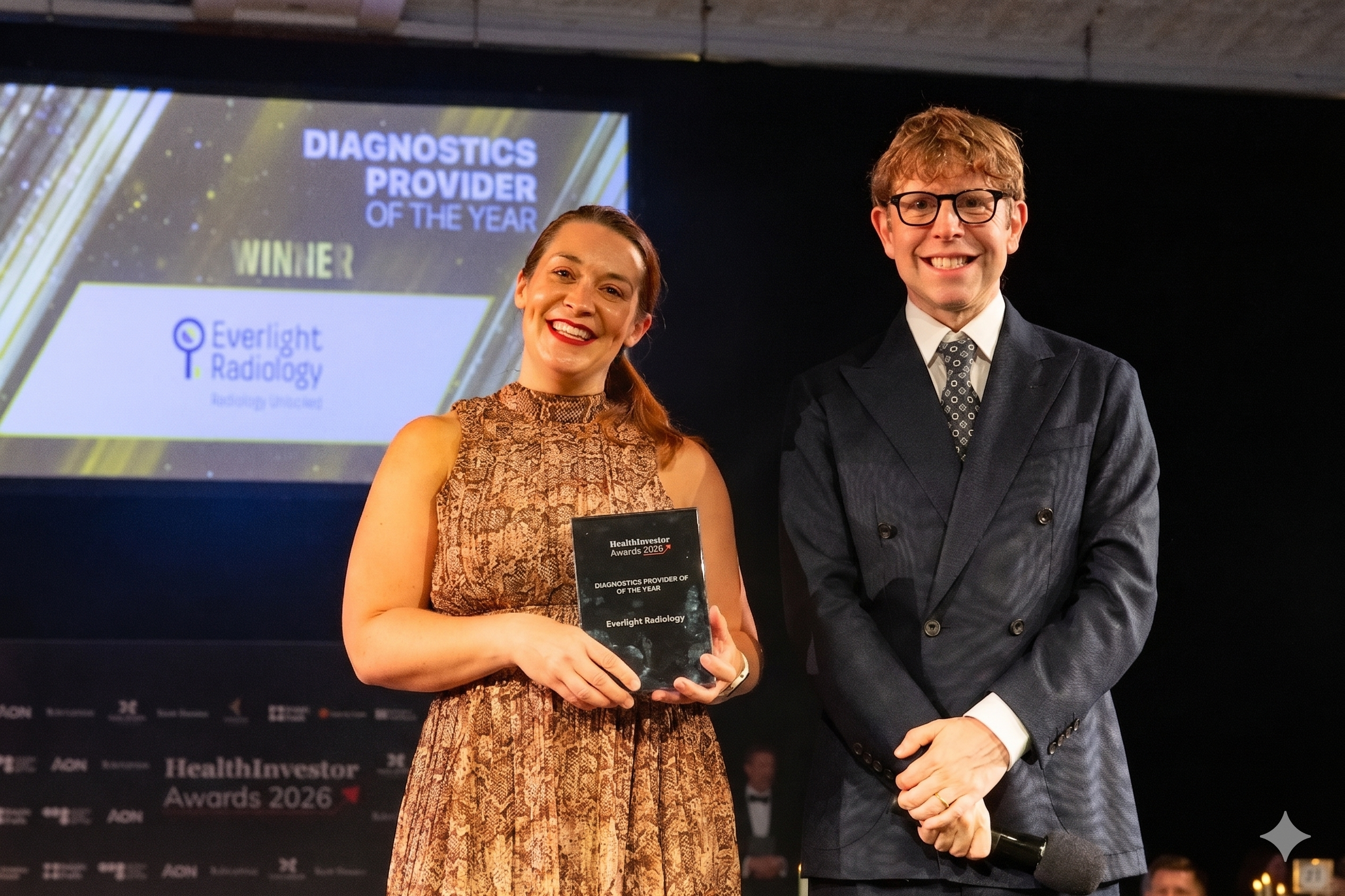 Global Marketing Lead Helen Gray accepting the award on behalf of the Everlight Radiology team
