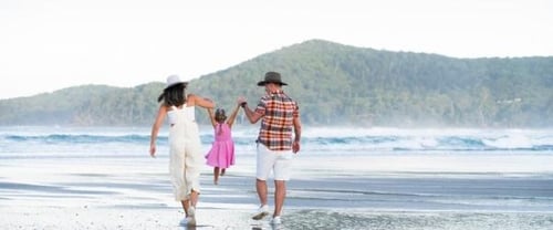 Michael Mol beach family swinging 600x250px